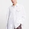 Baumwollbluse mit Häkelapplikation